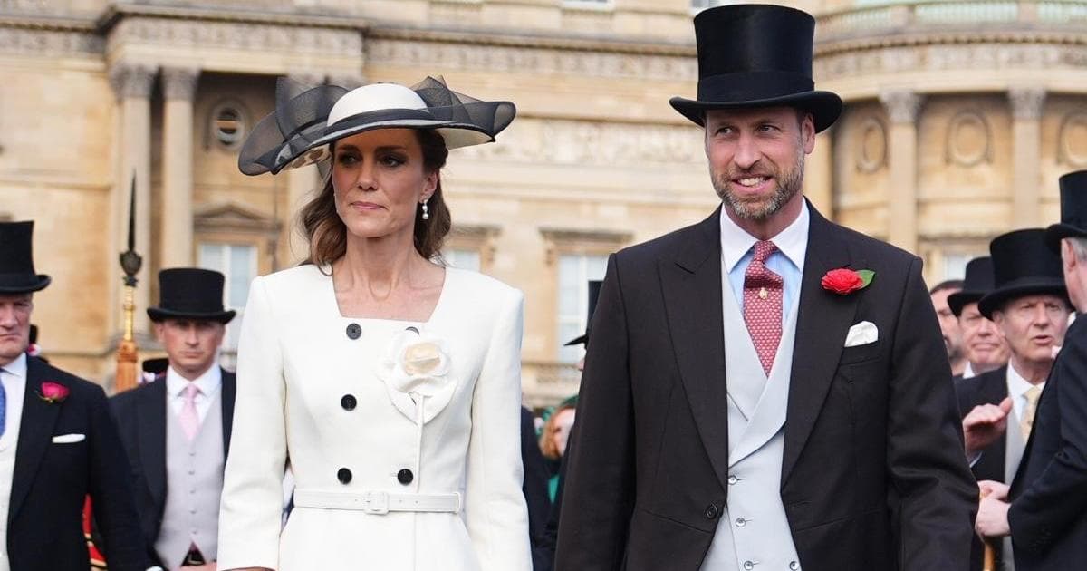 Prince William and Princess Kate walking outside in the rain at Peter Phillips' wedding in Gloucestershire, William holding an umbrella over Kate
