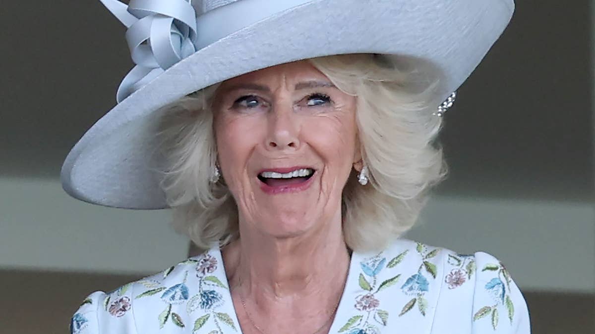 Queen Camilla in the royal carriage at Royal Ascot 2026, smiling at crowds in the parade ring alongside King Charles
