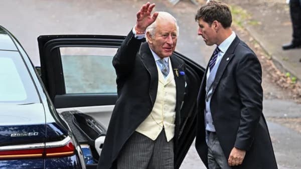 King Charles and Queen Camilla waving to well-wishers outside All Saints Church in Kemble, Gloucestershire, before departing for the Epsom Derby