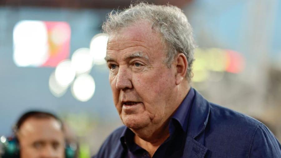 Jeremy Clarkson standing in a field at Diddly Squat Farm looking emotional, wearing a casual jacket