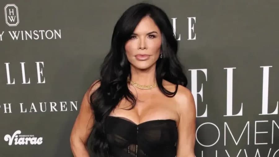 Lauren Sanchez Bezos in a sky-blue vintage John Galliano Dior crochet dress in Paris, accessorised with a silver Chanel clutch and oversized diamond earrings