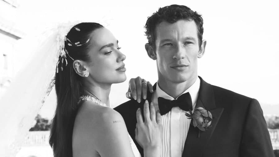 Dua Lipa in her custom Chanel haute couture wedding gown with husband Callum Turner at Villa Valguarnera in Sicily